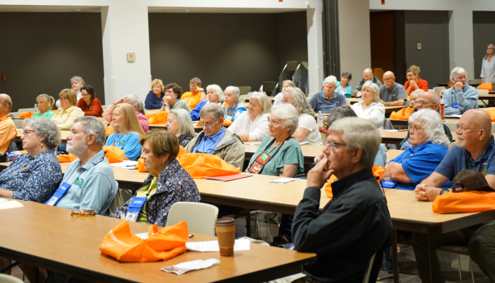 Participants at a Fall in the Gardens presentation inddors.